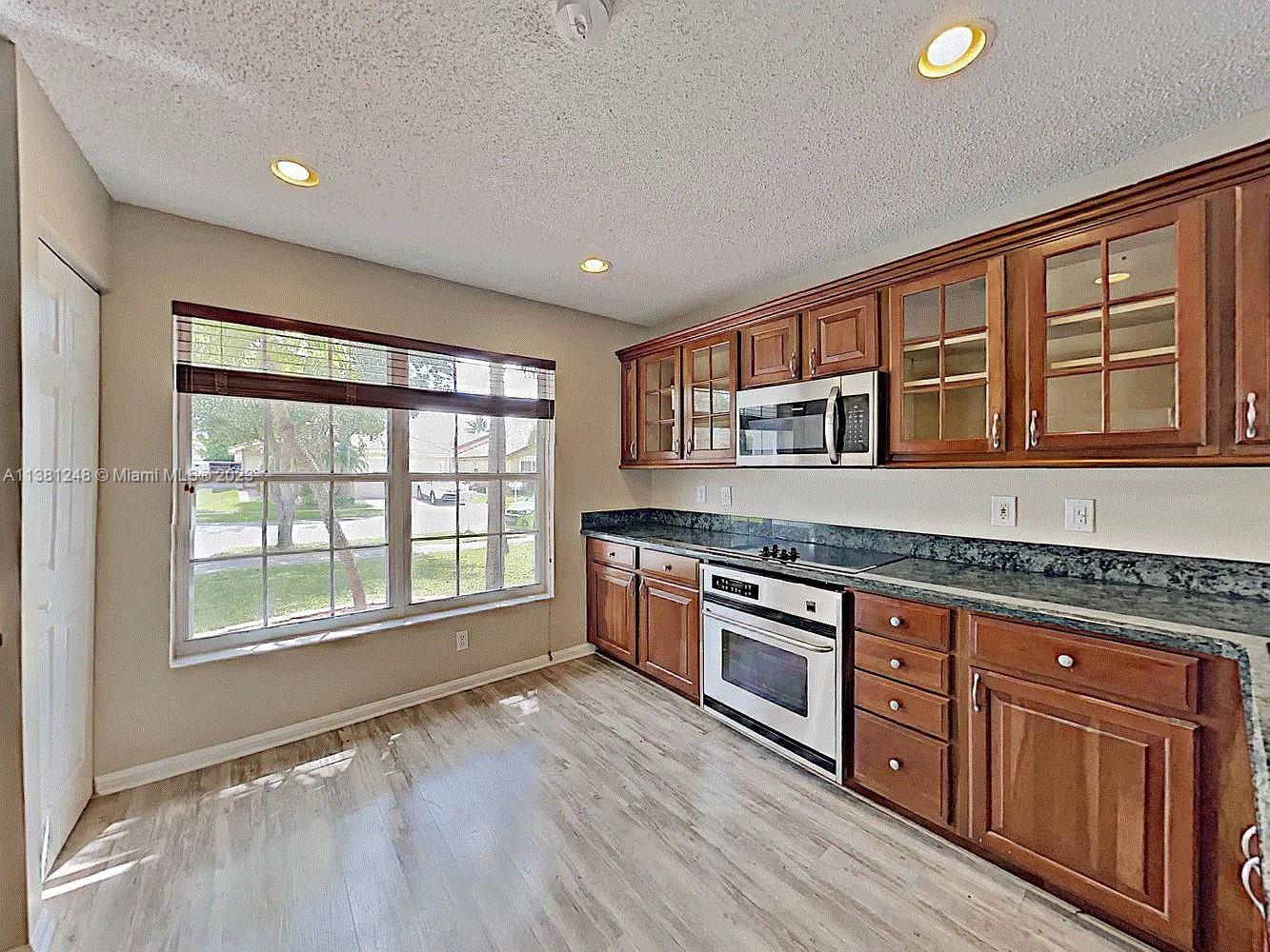 Silver Lakes Miramar, FL 33029 - Photo 10 of 17 a kitchen with stainless steel appliances granite countertop a stove and a sink