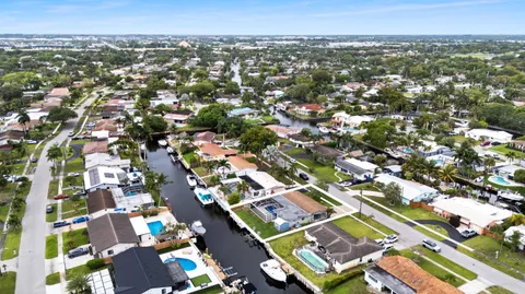an aerial view of residential building with green space
