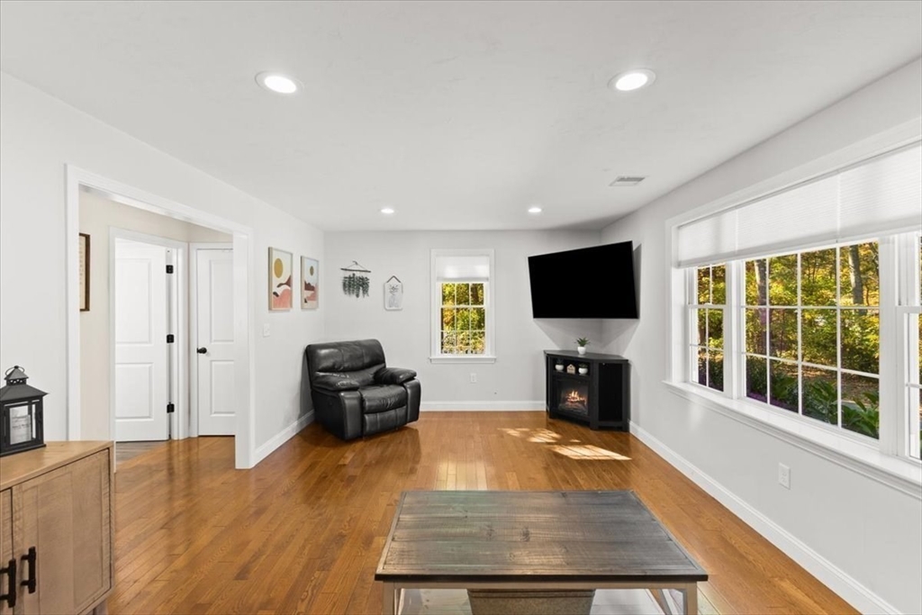 25 Upton Street Hanson, MA 02341 - Photo 13 of 30 a living room with furniture and a flat screen tv