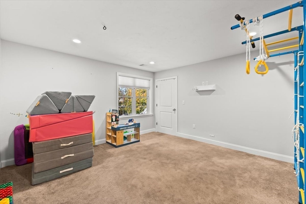 25 Upton Street Hanson, MA 02341 - Photo 19 of 30 a view of game room with window and lamp