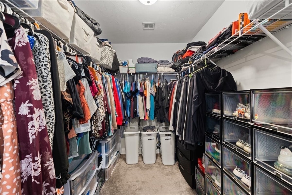 25 Upton Street Hanson, MA 02341 - Photo 24 of 30 a view of walk in closet with clothes and shoes