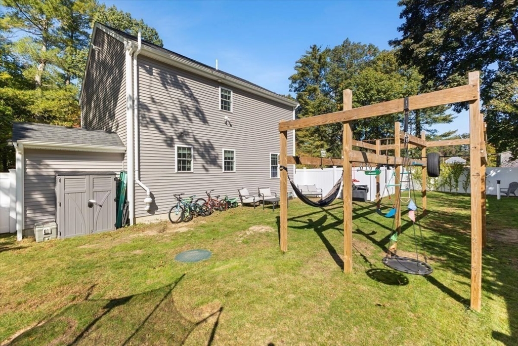 25 Upton Street Hanson, MA 02341 - Photo 26 of 30 a view of a patio with table and chairs and potted plants