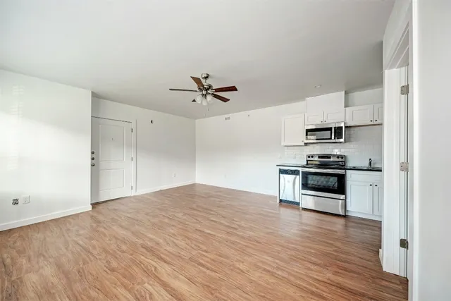 a view of kitchen with sink and stainless steel appliances