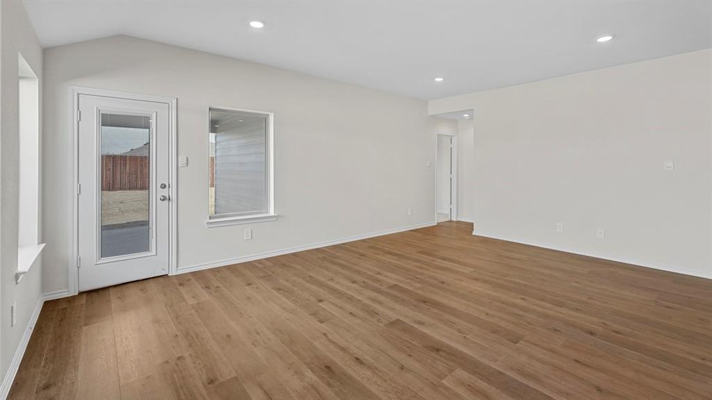 1953 Freeman Street Tyler, TX 75704 - Photo 13 of 32 Spacious interior featuring wood-finish flooring, vaulted ceilings, and recessed lighting