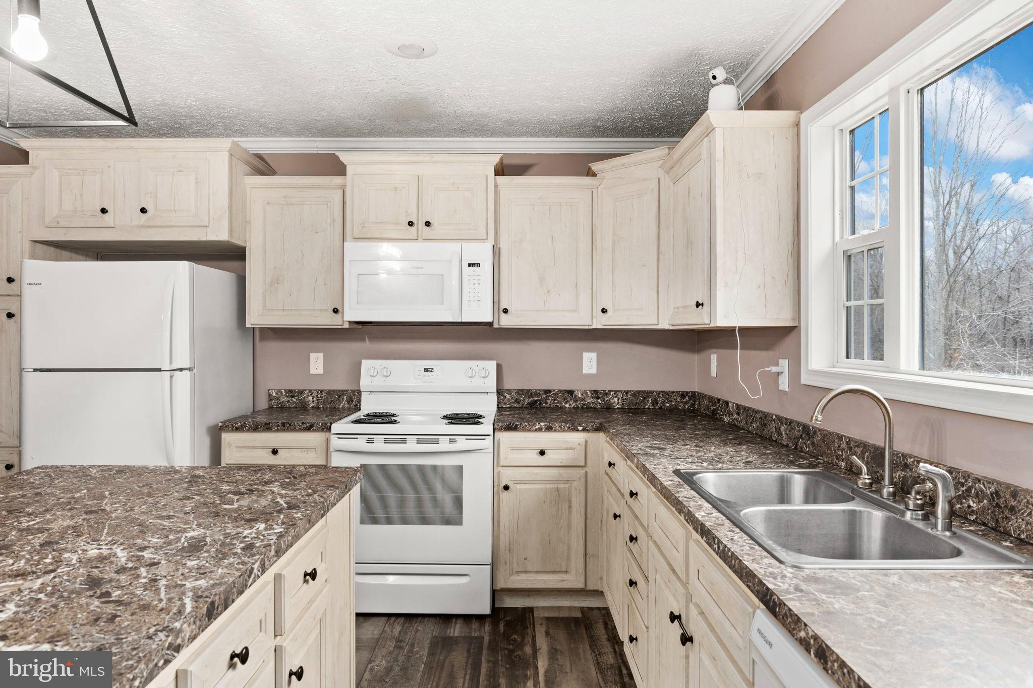 13115 Arcadia Road Woodford, VA 22580 - Photo 11 of 44 Bright and inviting kitchen with modern finishes.