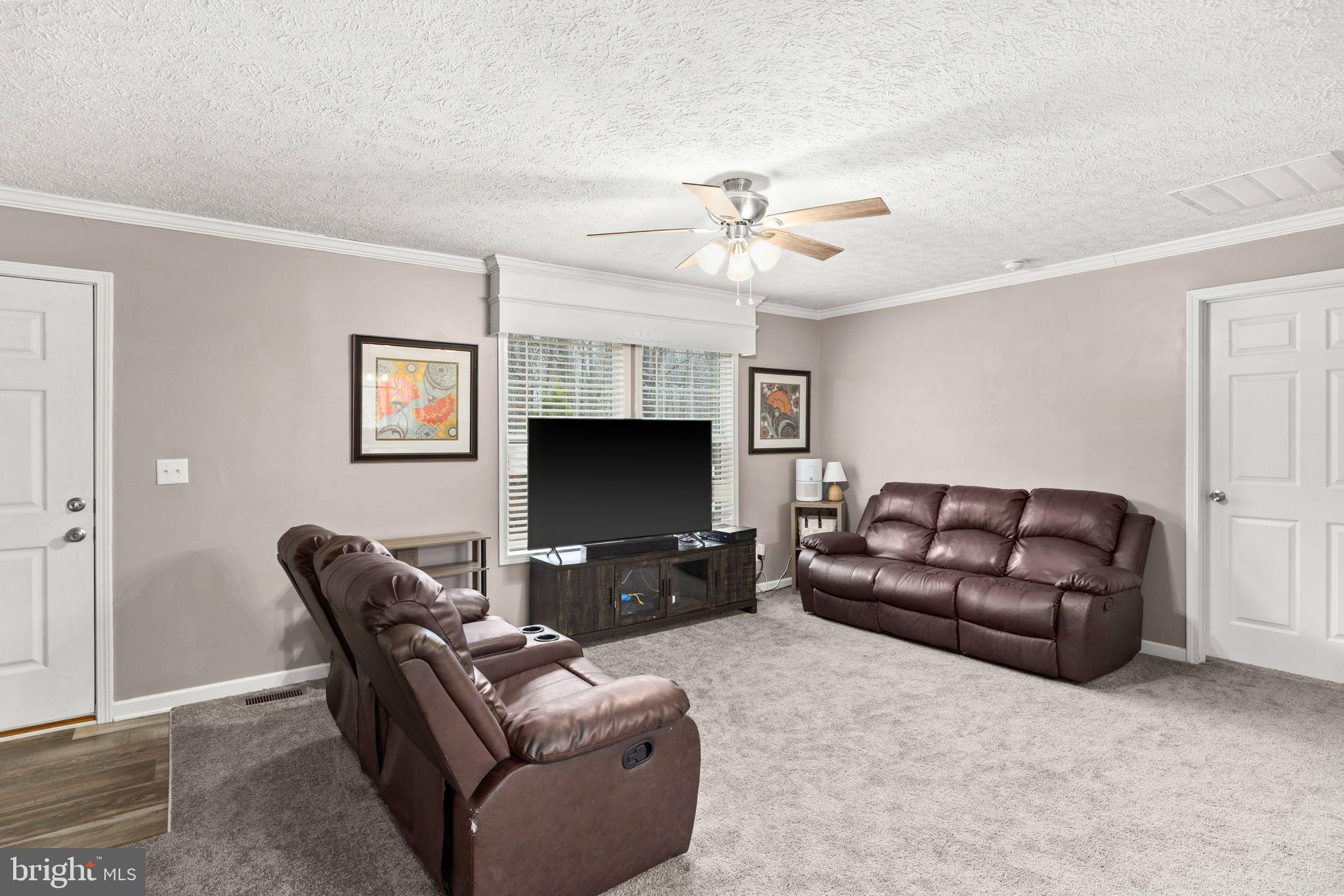 13115 Arcadia Road Woodford, VA 22580 - Photo 14 of 44 Cozy living space with modern charm.