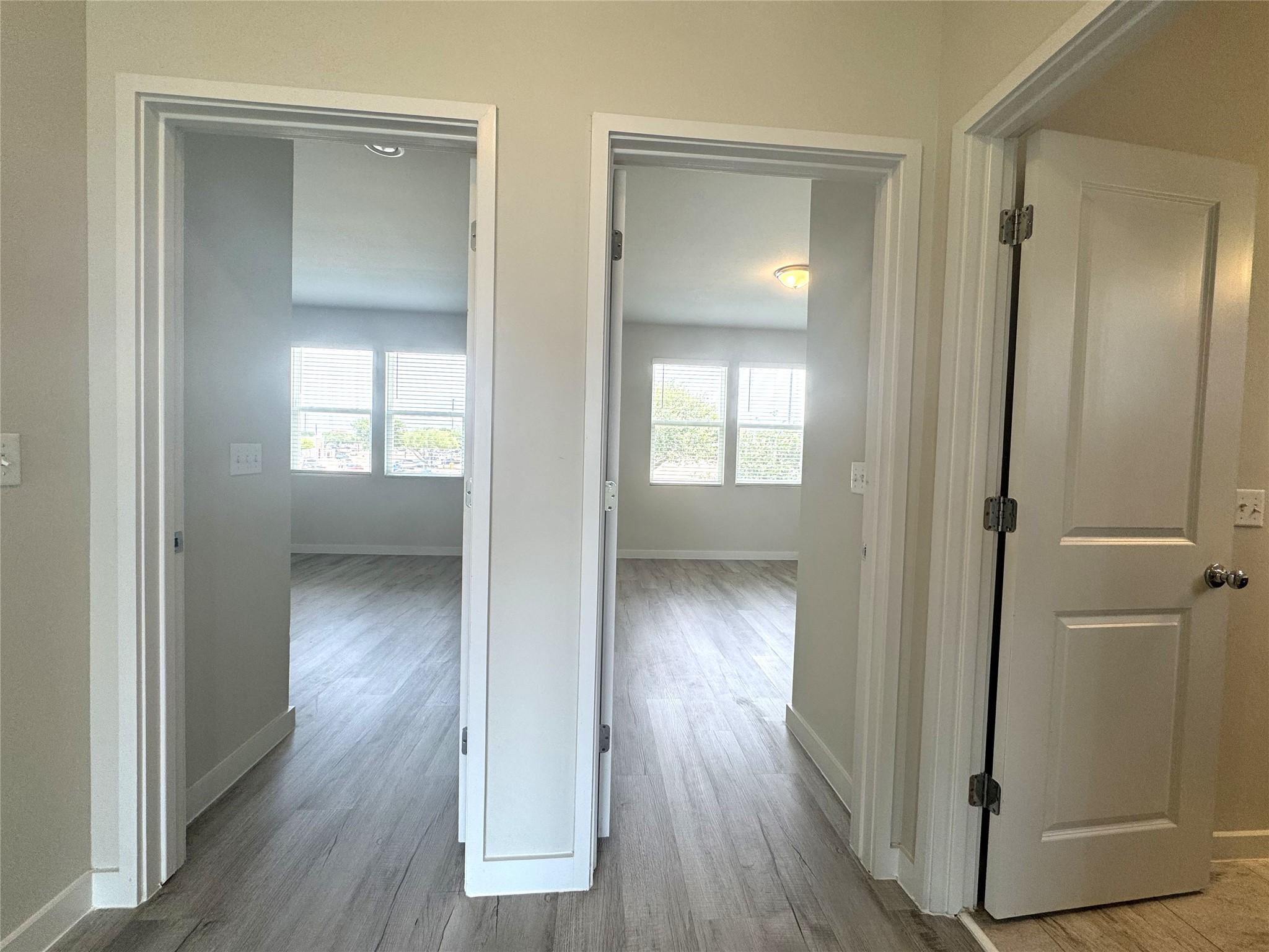 15102 Ryman Road Pflugerville, TX 78660 - Photo 6 of 12 wooden floor with white walls