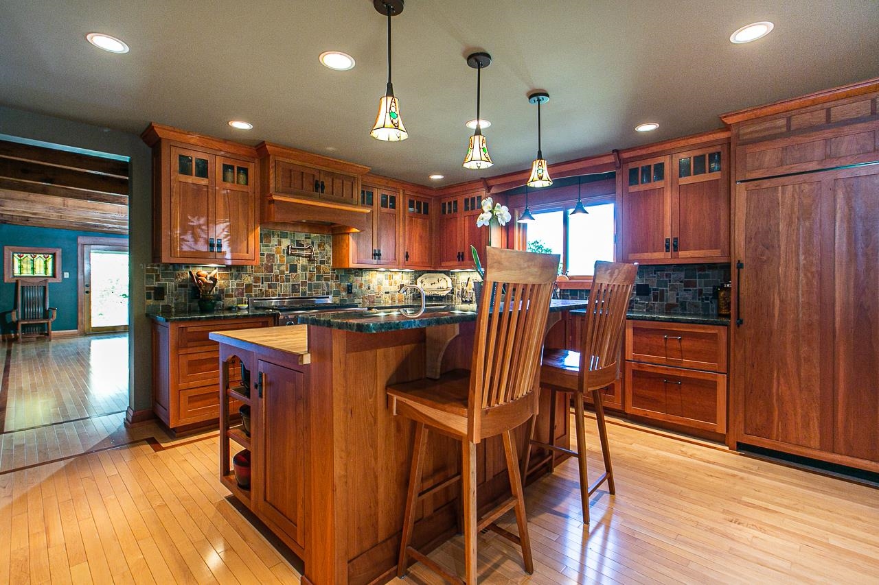 4757 North Hammer Road Scales Mound, IL 61075 - Photo 18 of 95 a kitchen with stainless steel appliances granite countertop a refrigerator a sink dishwasher a dining table and chairs with wooden floor