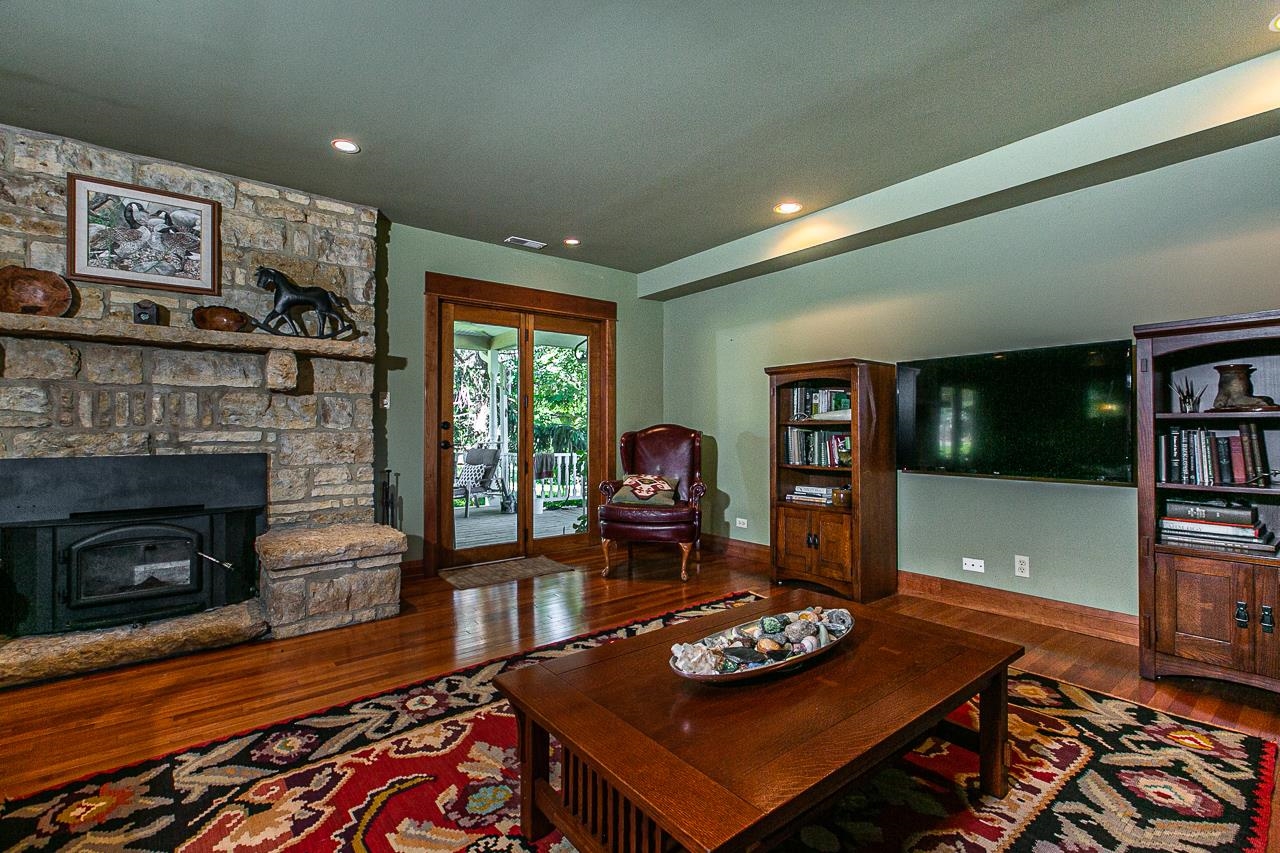 4757 North Hammer Road Scales Mound, IL 61075 - Photo 42 of 95 a living room with furniture and a fireplace