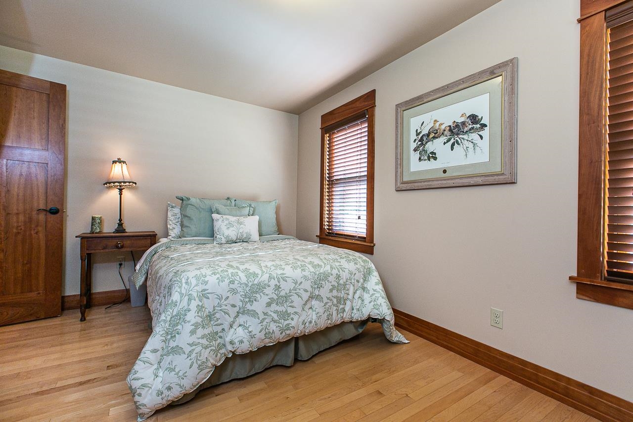 4757 North Hammer Road Scales Mound, IL 61075 - Photo 45 of 95 a bedroom with a bed and wooden floor