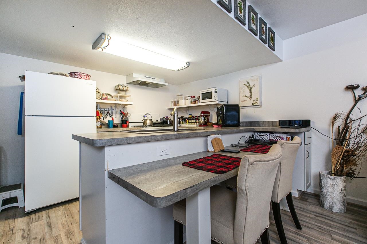 4757 North Hammer Road Scales Mound, IL 61075 - Photo 55 of 95 a kitchen with stainless steel appliances granite countertop a sink a refrigerator and a stove