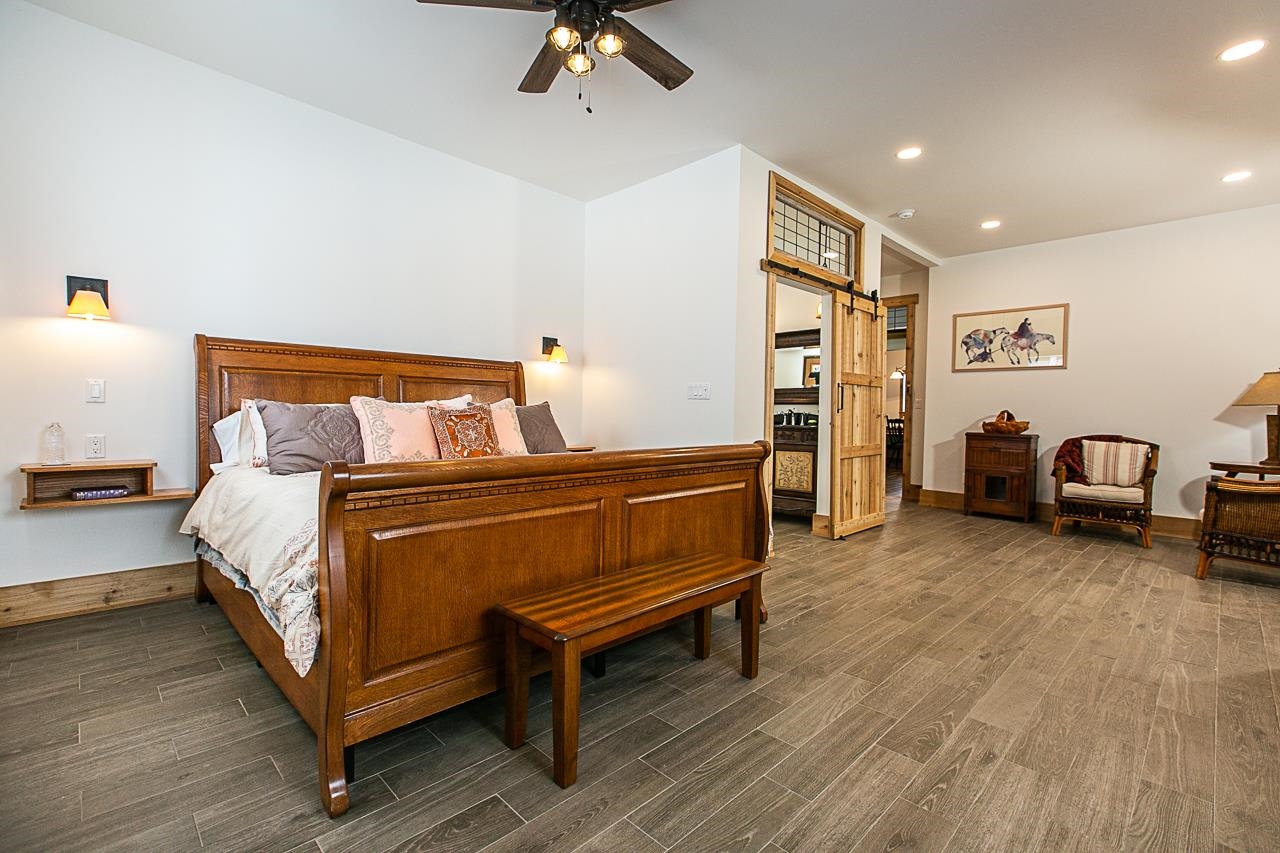 4757 North Hammer Road Scales Mound, IL 61075 - Photo 83 of 95 a bedroom with a bed and a chandelier