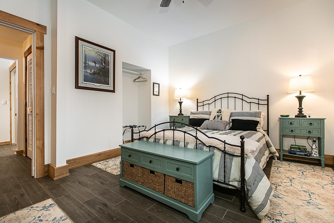 4757 North Hammer Road Scales Mound, IL 61075 - Photo 93 of 95 a bedroom with a bed and a chandelier