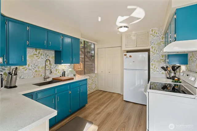 a kitchen with wooden cabinets and a sink
