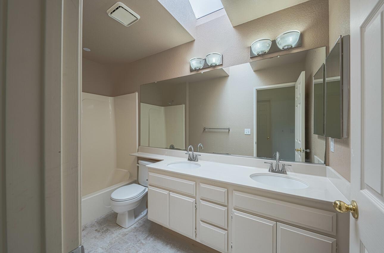 337 Quebrada Del Mar Road Marina, CA 93933 - Photo 11 of 44 a bathroom with a toilet sink and mirror