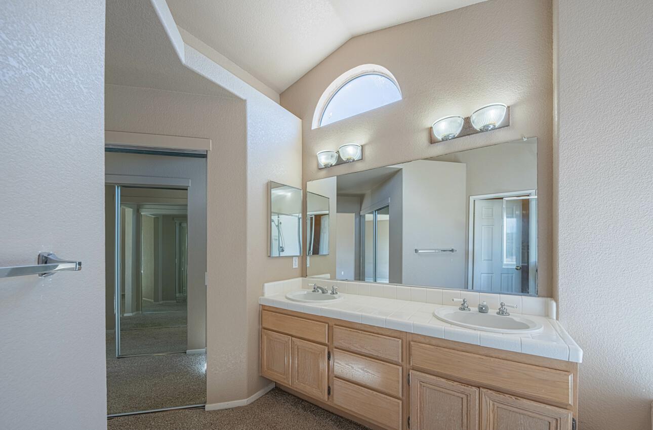 337 Quebrada Del Mar Road Marina, CA 93933 - Photo 13 of 44 a bathroom with a double vanity sink and a mirror
