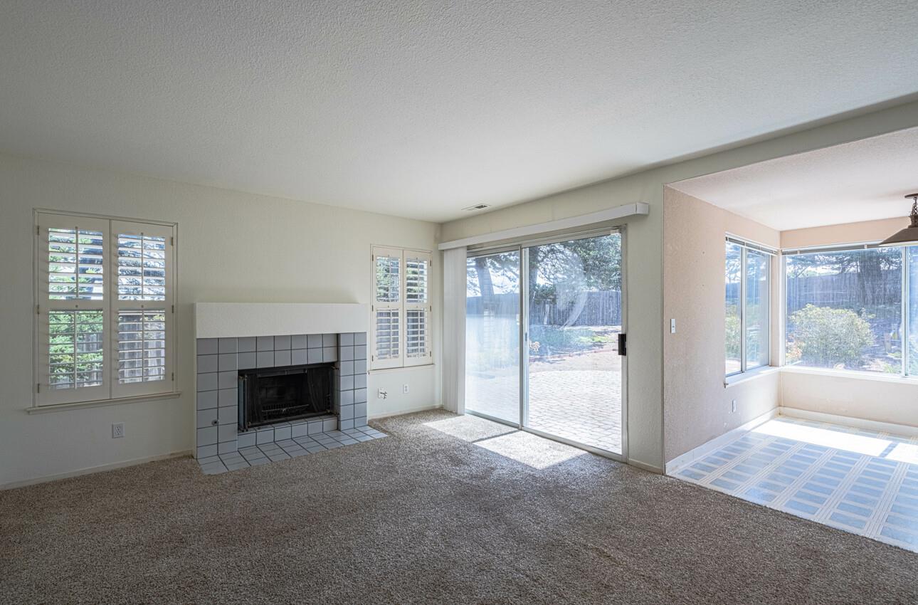 337 Quebrada Del Mar Road Marina, CA 93933 - Photo 2 of 44 a big room with windows and a fireplace