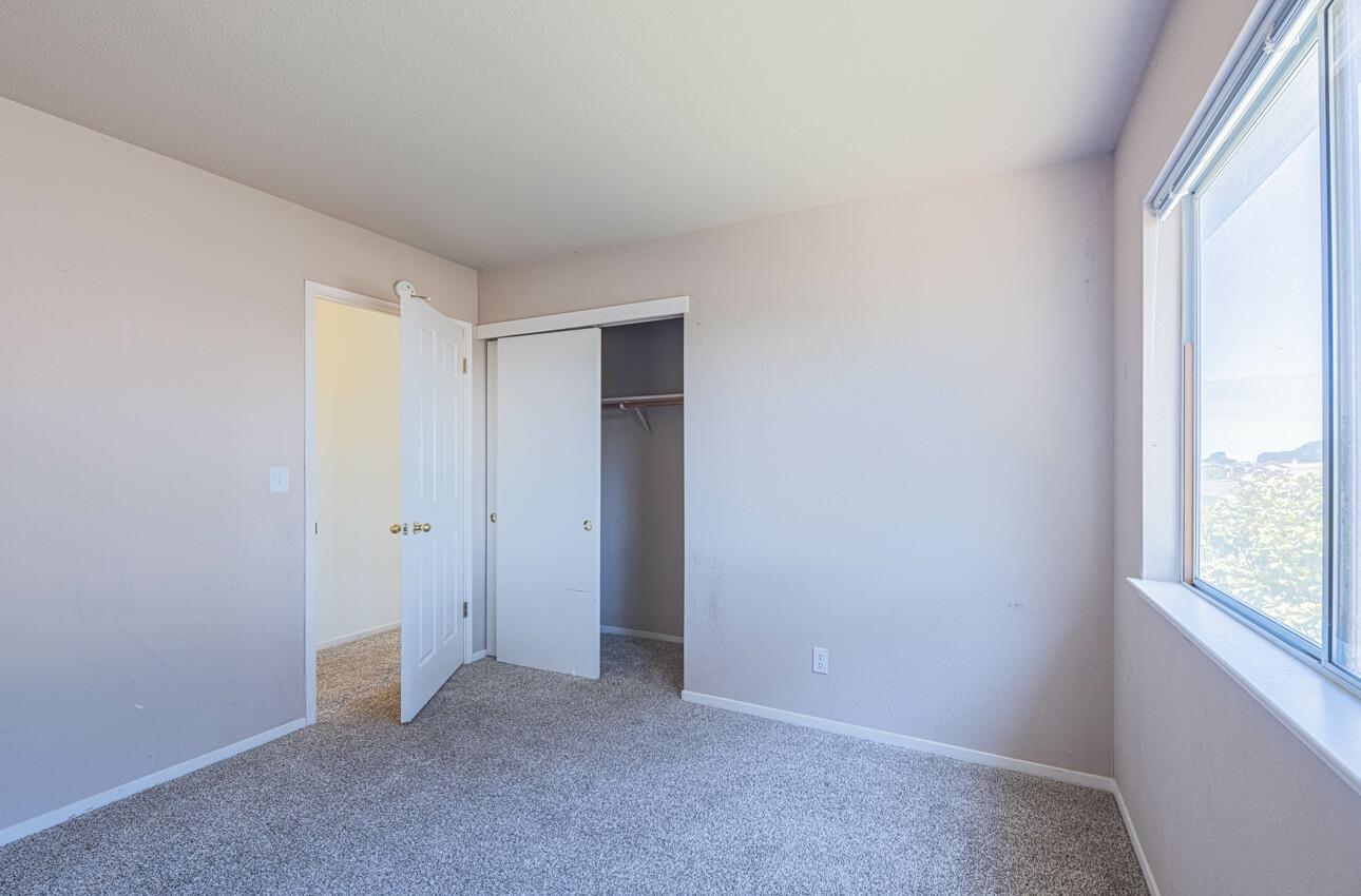 337 Quebrada Del Mar Road Marina, CA 93933 - Photo 32 of 44 an empty room with windows and closet