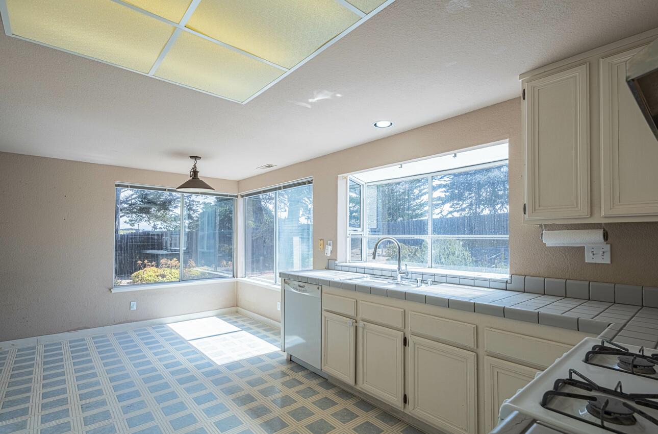 337 Quebrada Del Mar Road Marina, CA 93933 - Photo 4 of 44 a kitchen with stainless steel appliances granite countertop a sink and a window