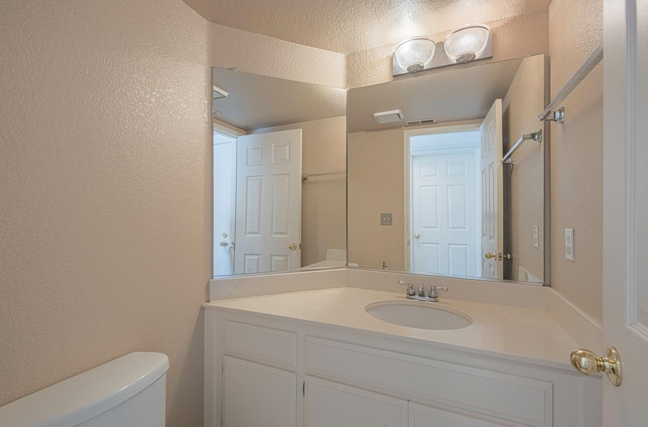 337 Quebrada Del Mar Road Marina, CA 93933 - Photo 41 of 44 a bathroom with a sink a toilet and a mirror