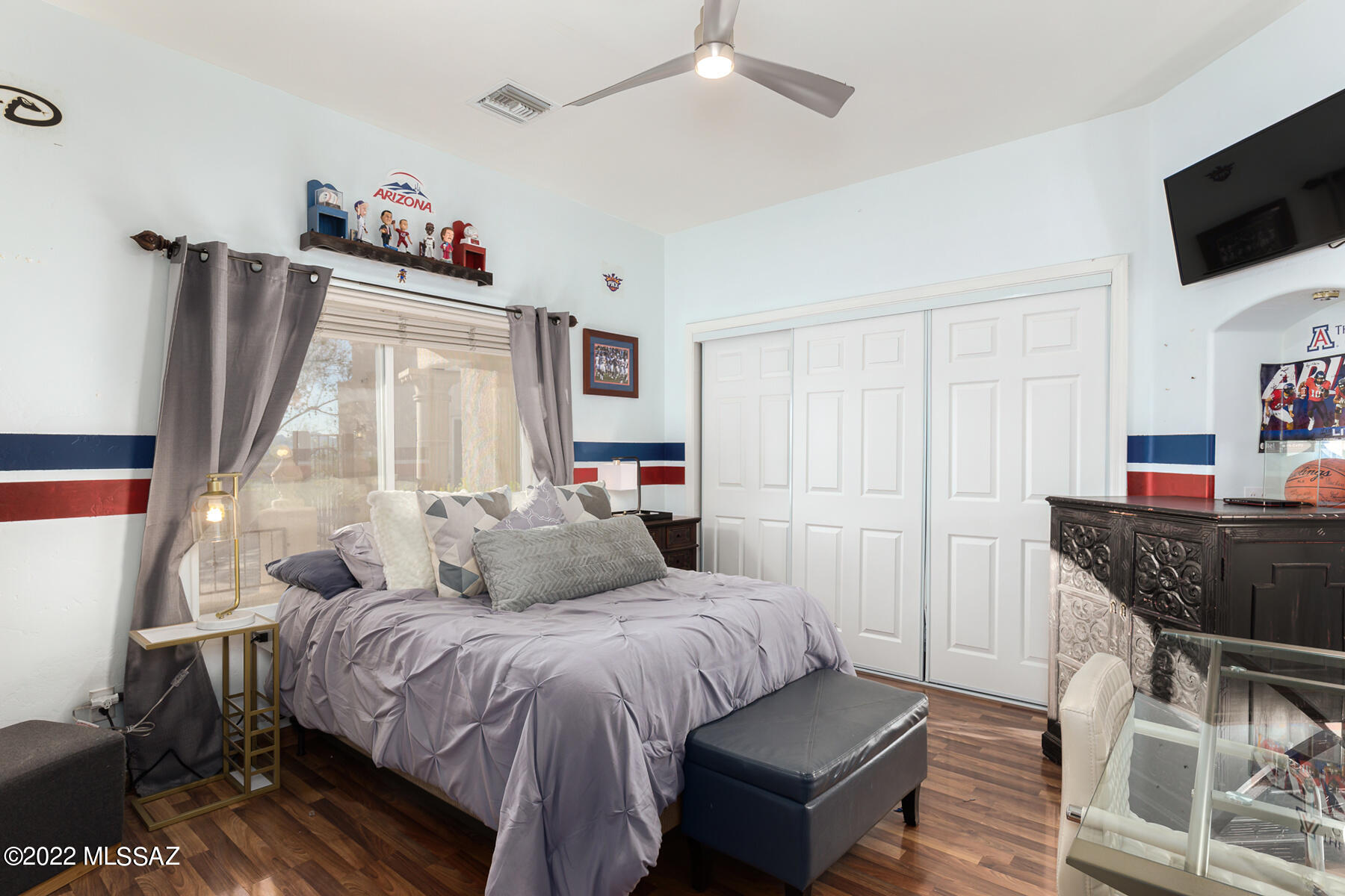 317 Valley View Drive Rio Rico, AZ 85648 - Photo 41 of 49 a bedroom with a bed and flat screen tv