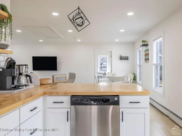 a bedroom with a bed and a view of bedroom