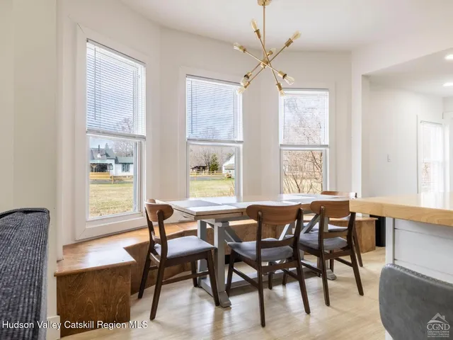 a kitchen with stainless steel appliances a refrigerator sink and cabinets