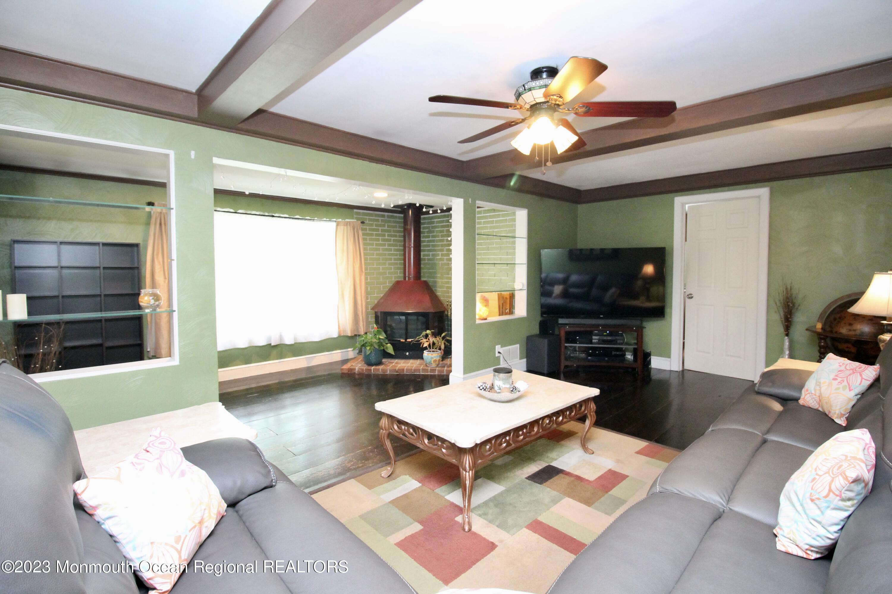 216 Lenape Trail Jackson, NJ 08527 - Photo 14 of 58 a living room with furniture a rug and a large window