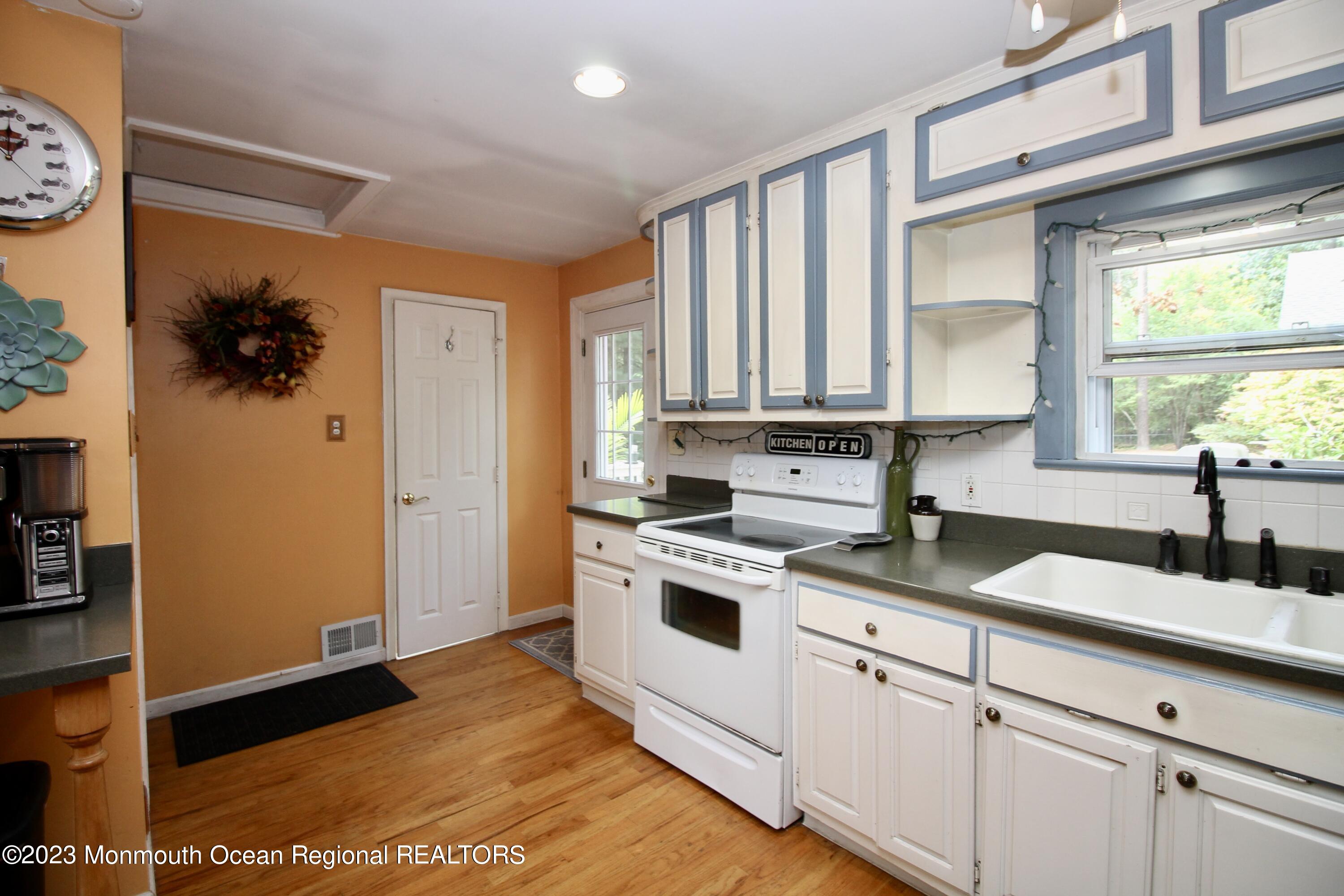 216 Lenape Trail Jackson, NJ 08527 - Photo 19 of 58 a kitchen with a sink cabinets and window