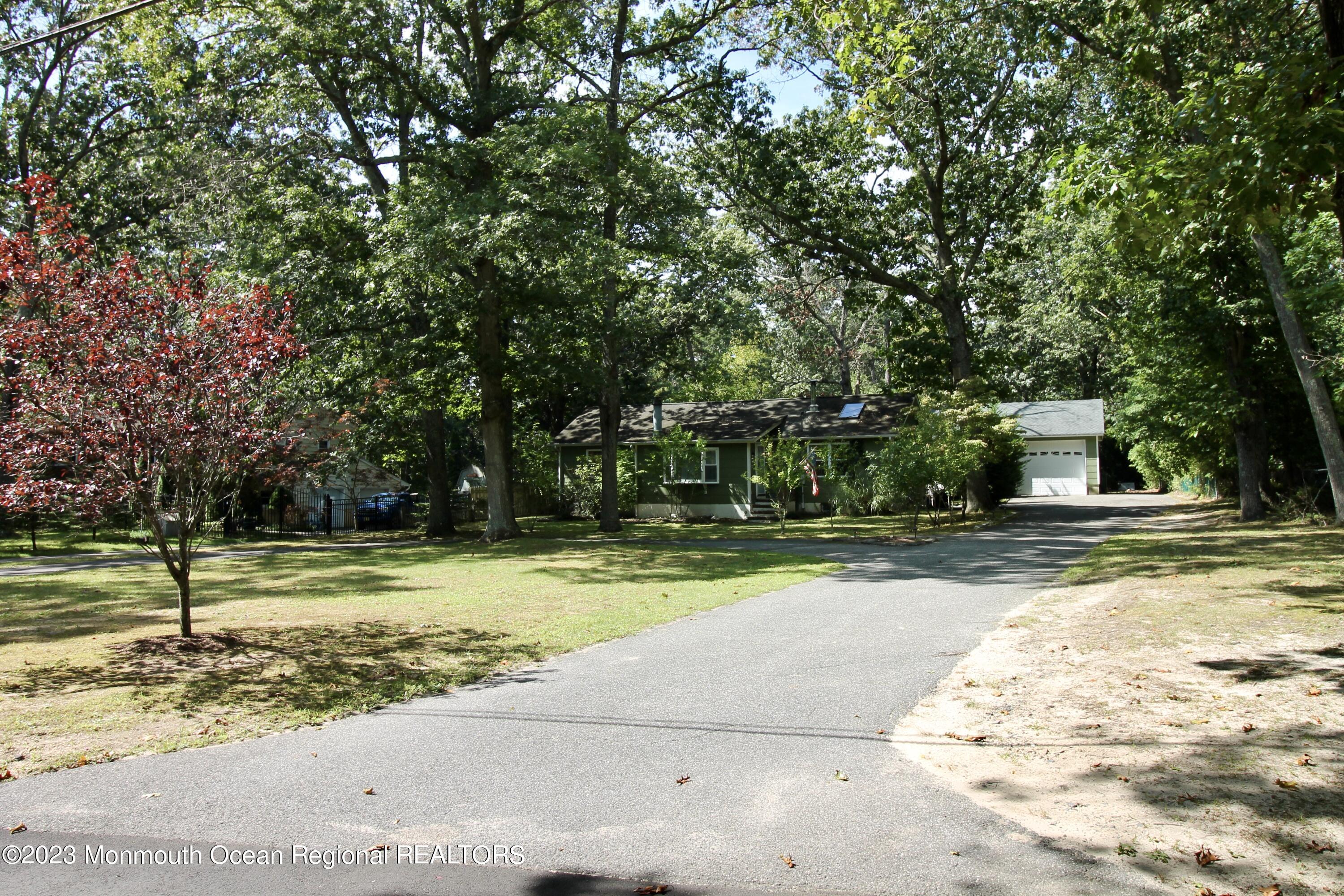 216 Lenape Trail Jackson, NJ 08527 - Photo 2 of 58 a view of a yard with a trees