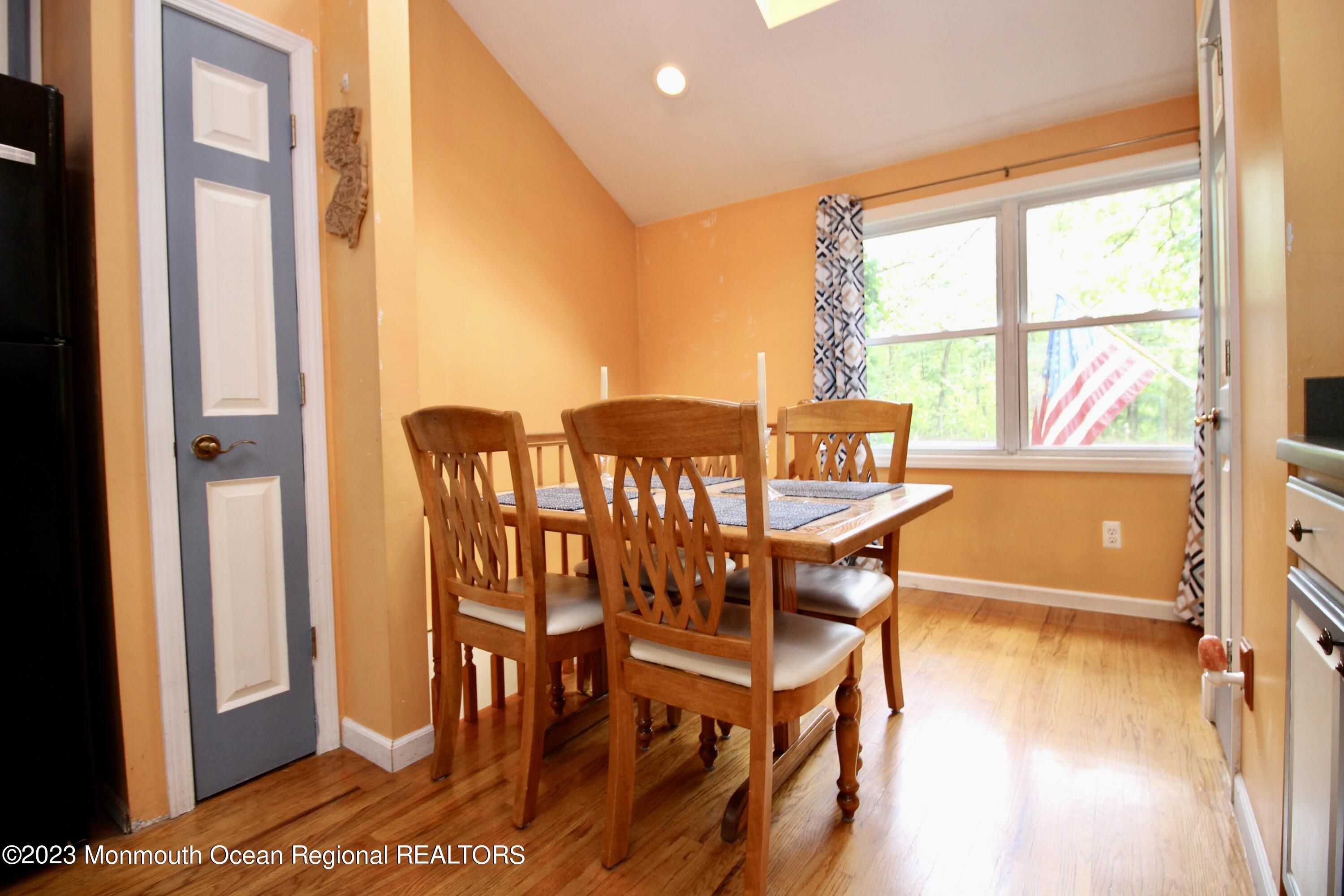 216 Lenape Trail Jackson, NJ 08527 - Photo 21 of 58 a view of a dining room with furniture and a window