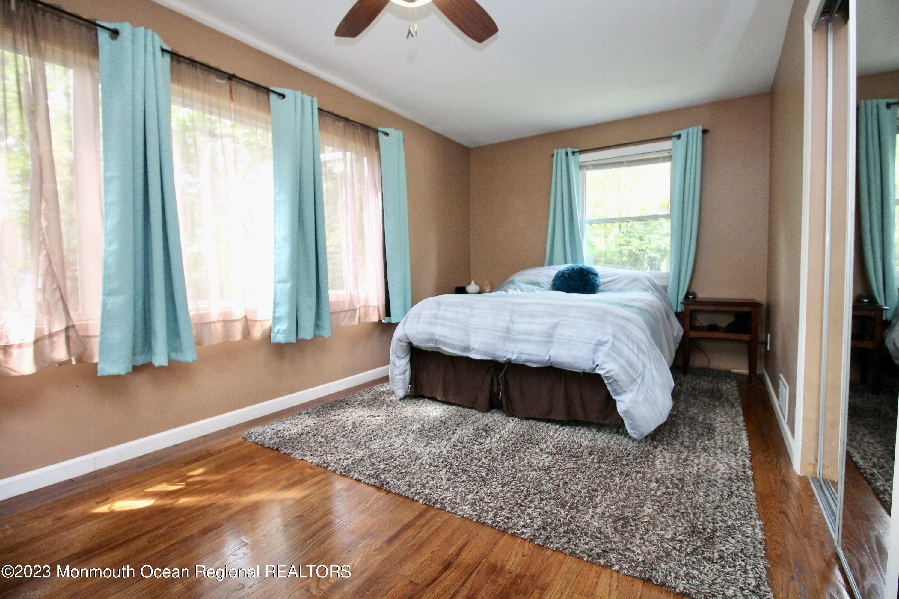 216 Lenape Trail Jackson, NJ 08527 - Photo 26 of 58 a bed sitting in a bedroom next to a window