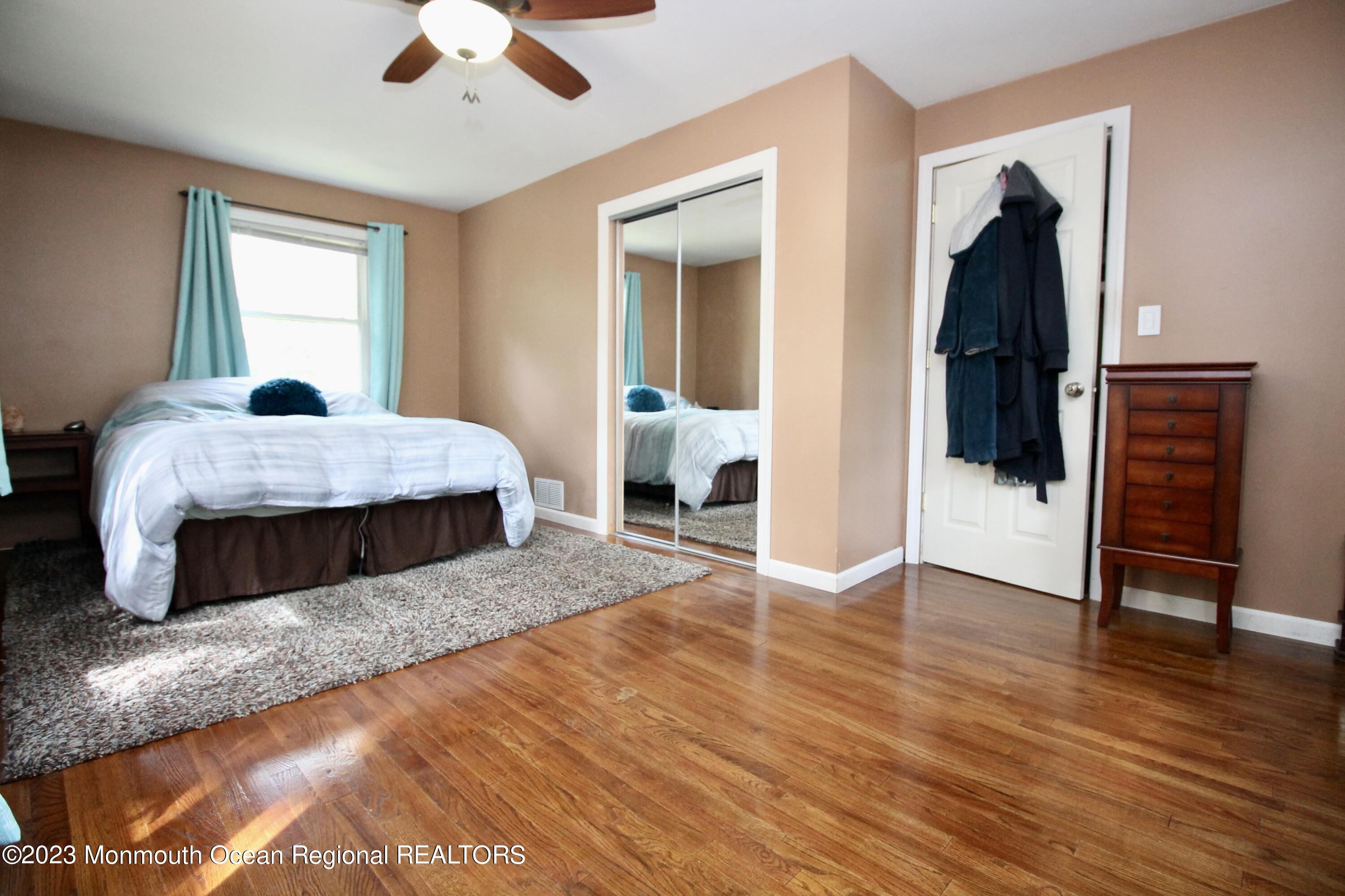216 Lenape Trail Jackson, NJ 08527 - Photo 28 of 58 a bedroom with a bed and a walk in closet