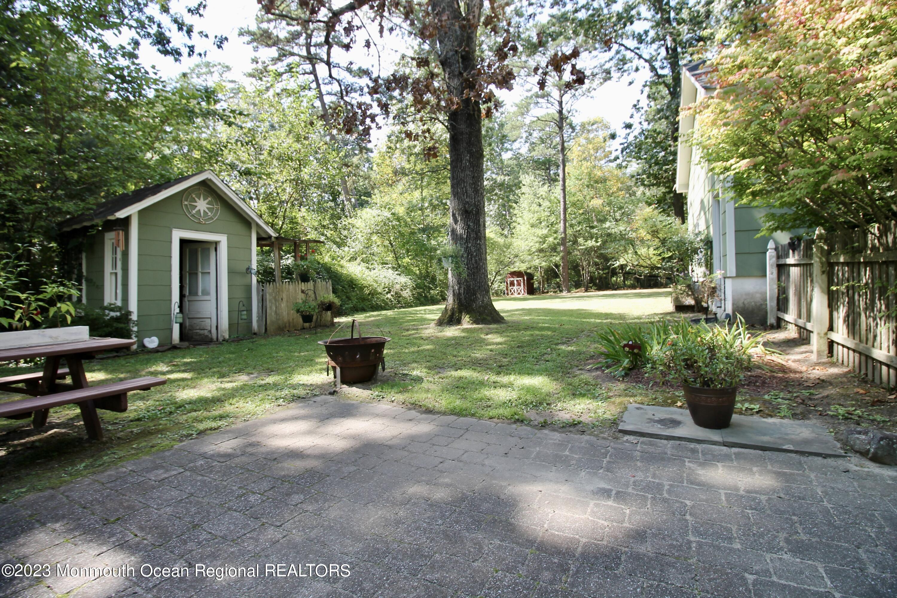 216 Lenape Trail Jackson, NJ 08527 - Photo 43 of 58 a view of a house with backyard and sitting area