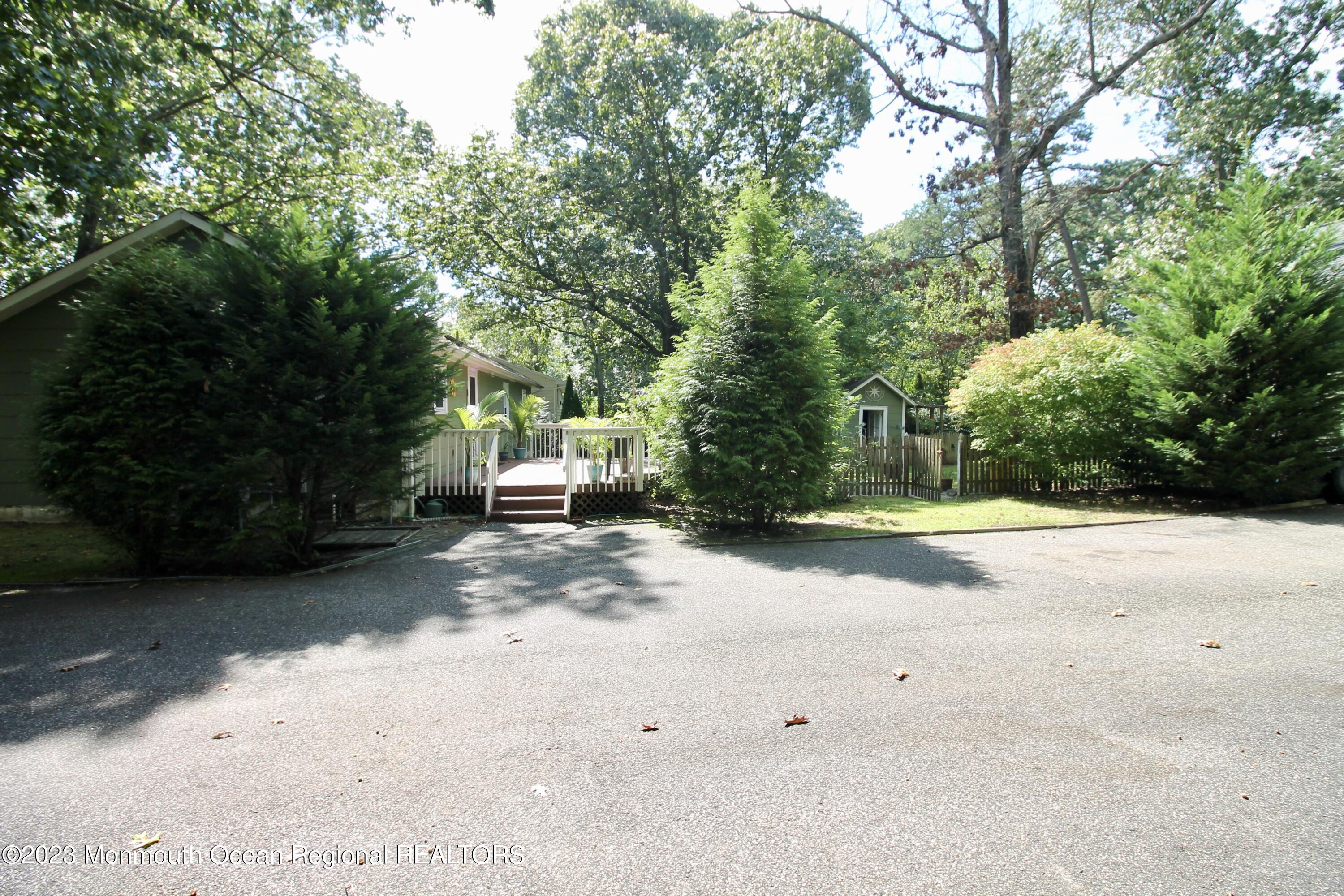 216 Lenape Trail Jackson, NJ 08527 - Photo 46 of 58 a view of street and tree