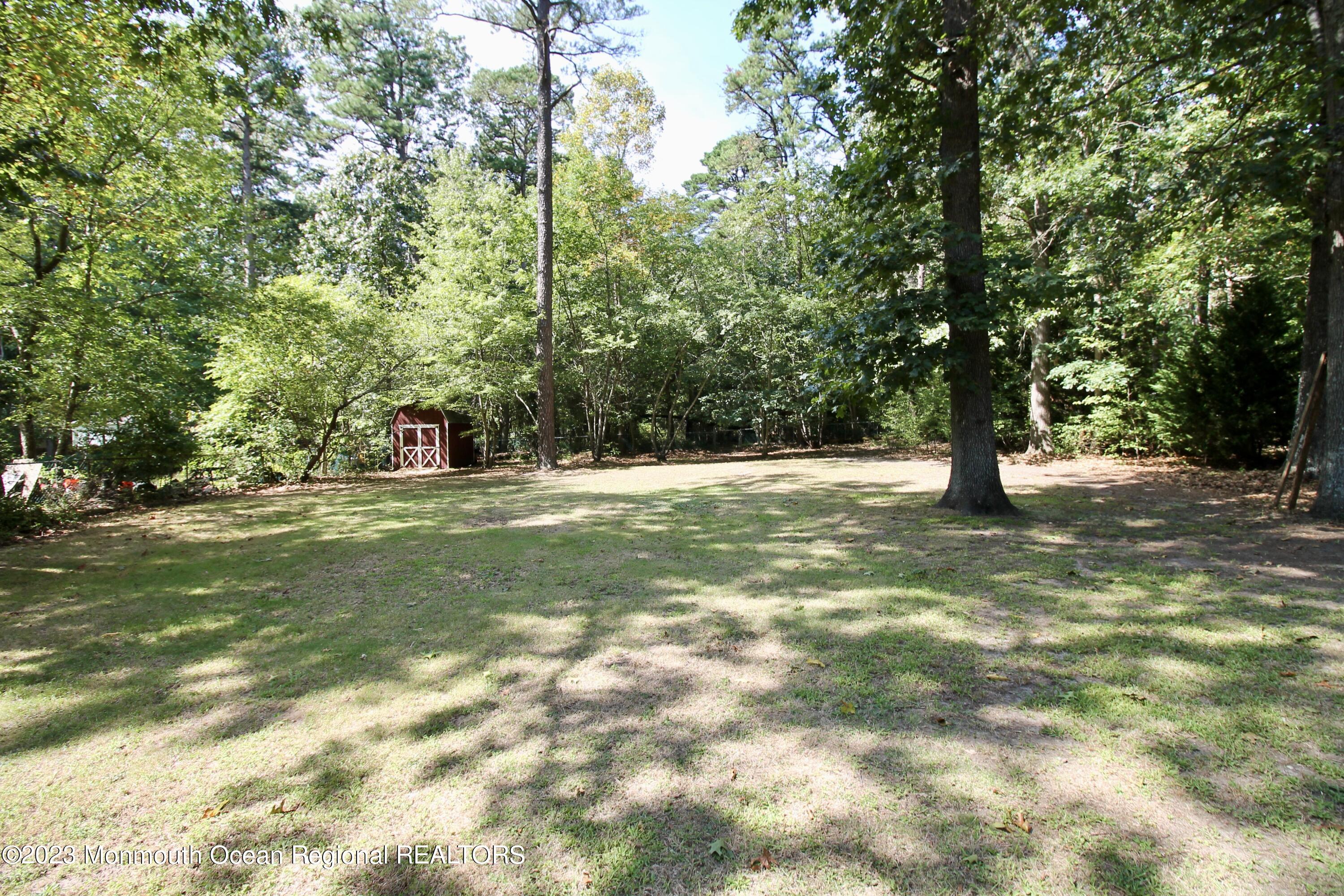 216 Lenape Trail Jackson, NJ 08527 - Photo 56 of 58 a view of outdoor space with trees all around