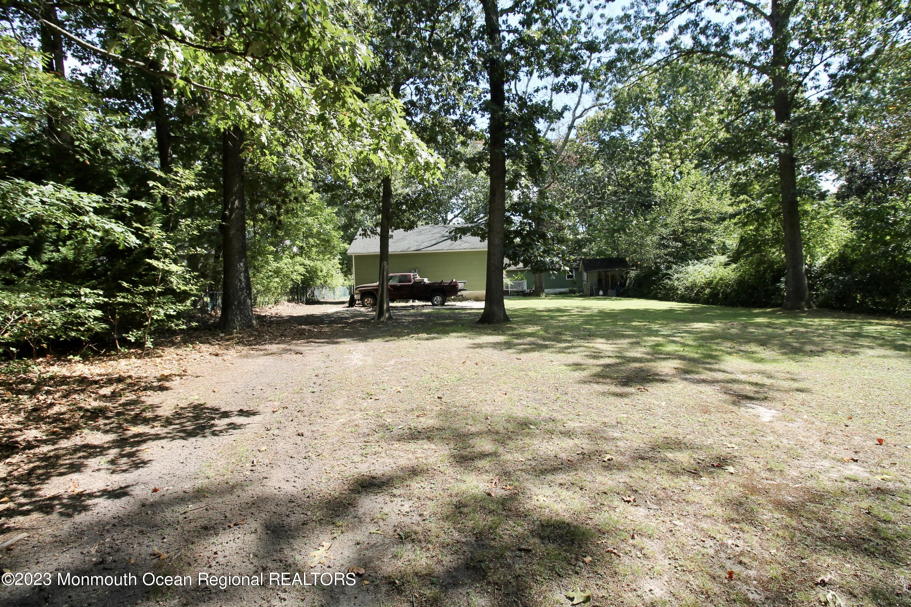 216 Lenape Trail Jackson, NJ 08527 - Photo 58 of 58 a view of a yard with a tree