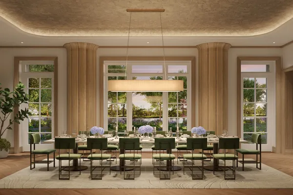a living room with furniture and large windows