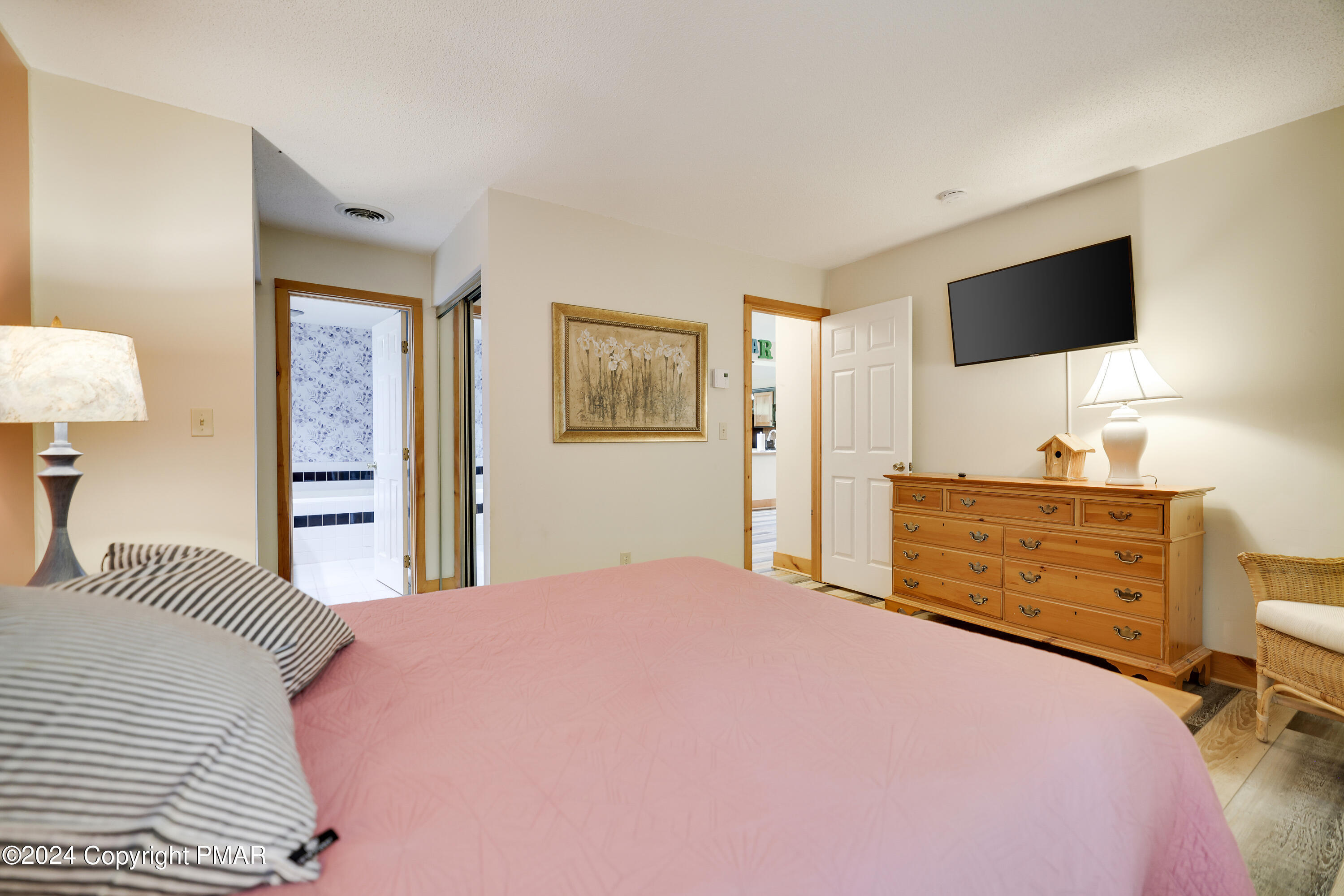 84 Short Hill Rd Lake Lake Harmony, PA 18624 - Photo 22 of 38 a bedroom with a bed and a flat screen tv