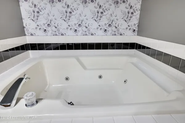 a white toilet sitting next to a bathroom