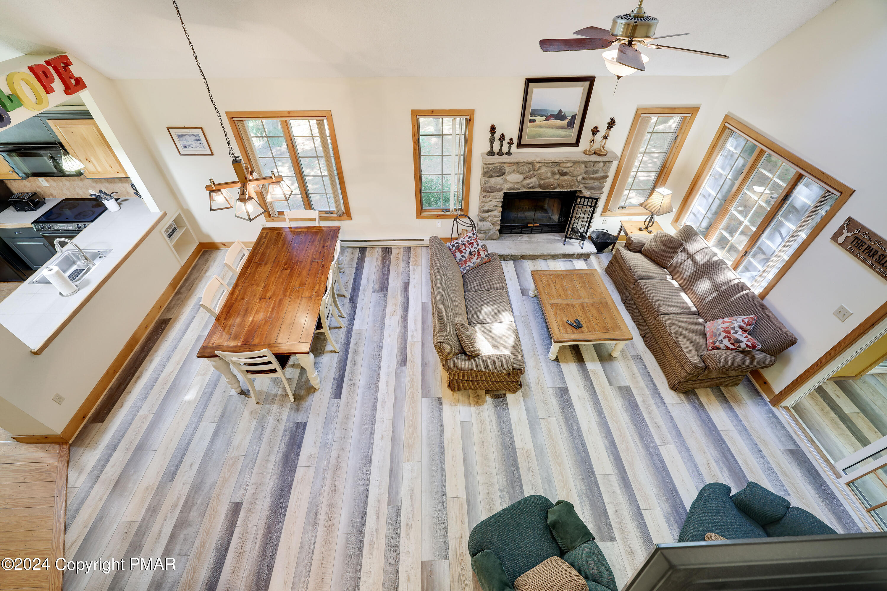 84 Short Hill Rd Lake Lake Harmony, PA 18624 - Photo 30 of 38 a living room with furniture and a fireplace