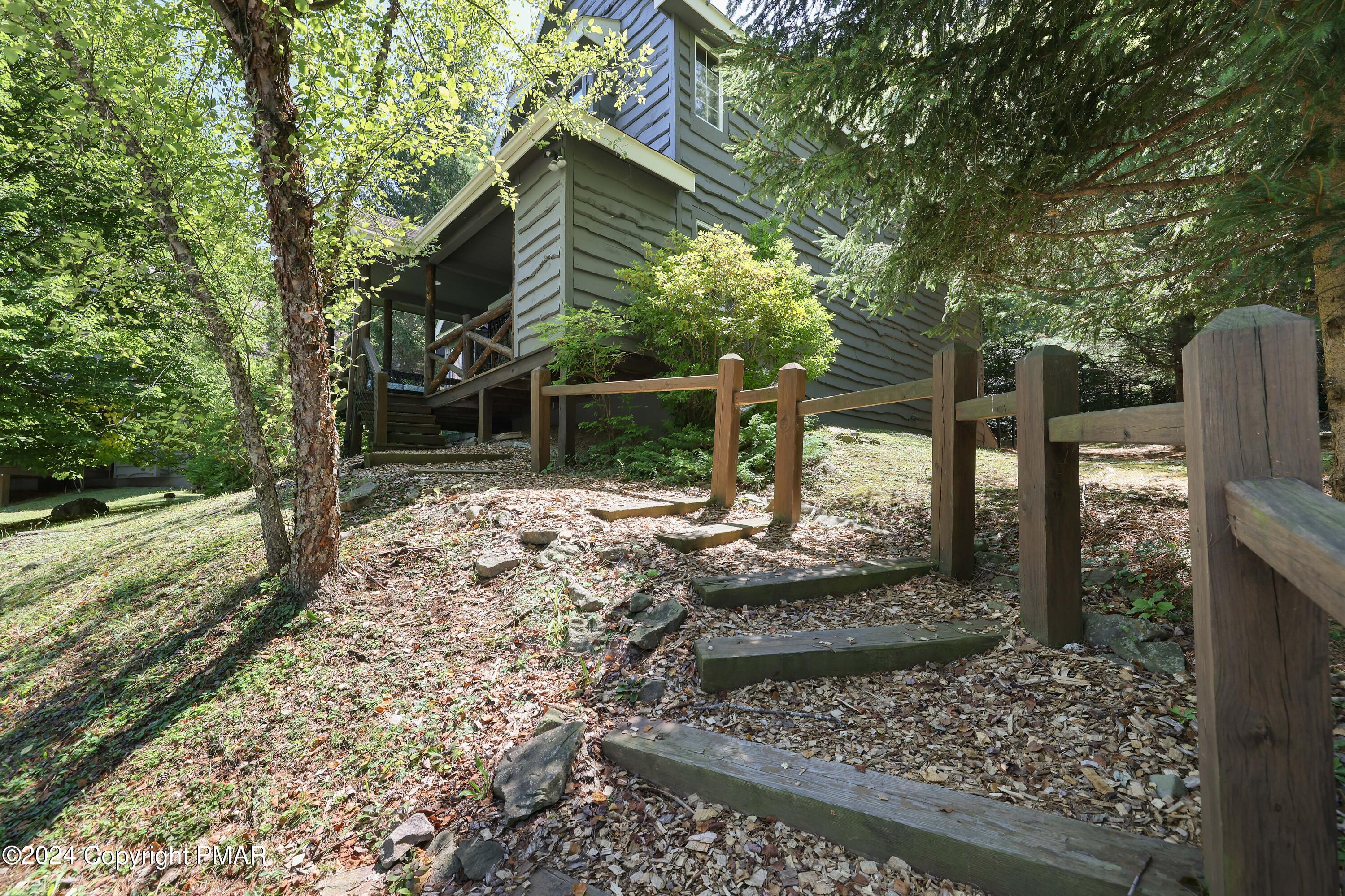 84 Short Hill Rd Lake Lake Harmony, PA 18624 - Photo 3 of 38 a view of a yard with wooden fence
