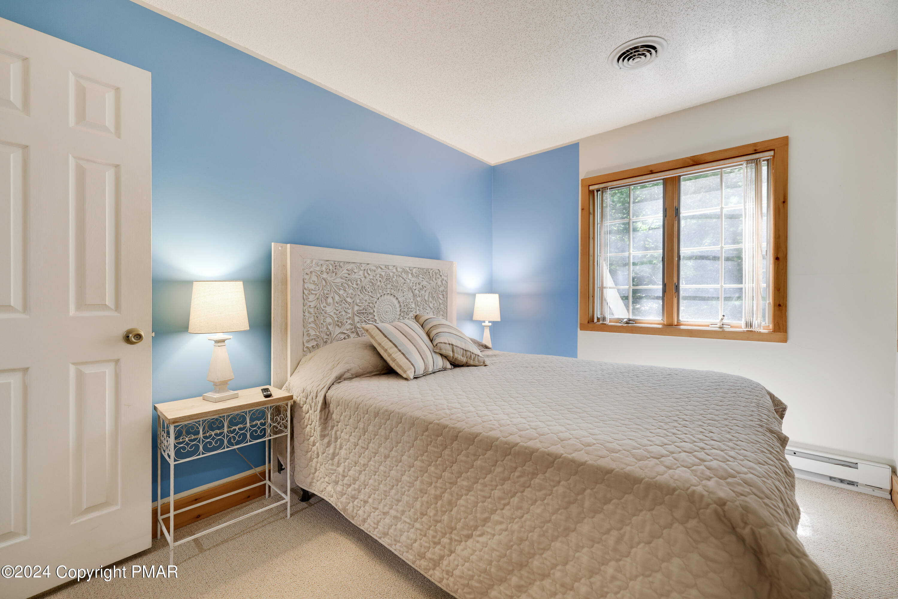 84 Short Hill Rd Lake Lake Harmony, PA 18624 - Photo 35 of 38 a bedroom with a bed and a window