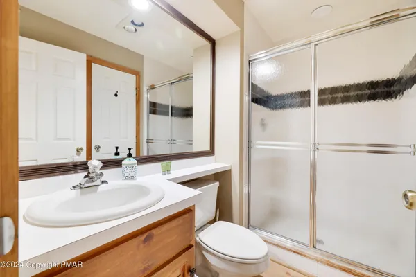 a kitchen with granite countertop a refrigerator stove and sink
