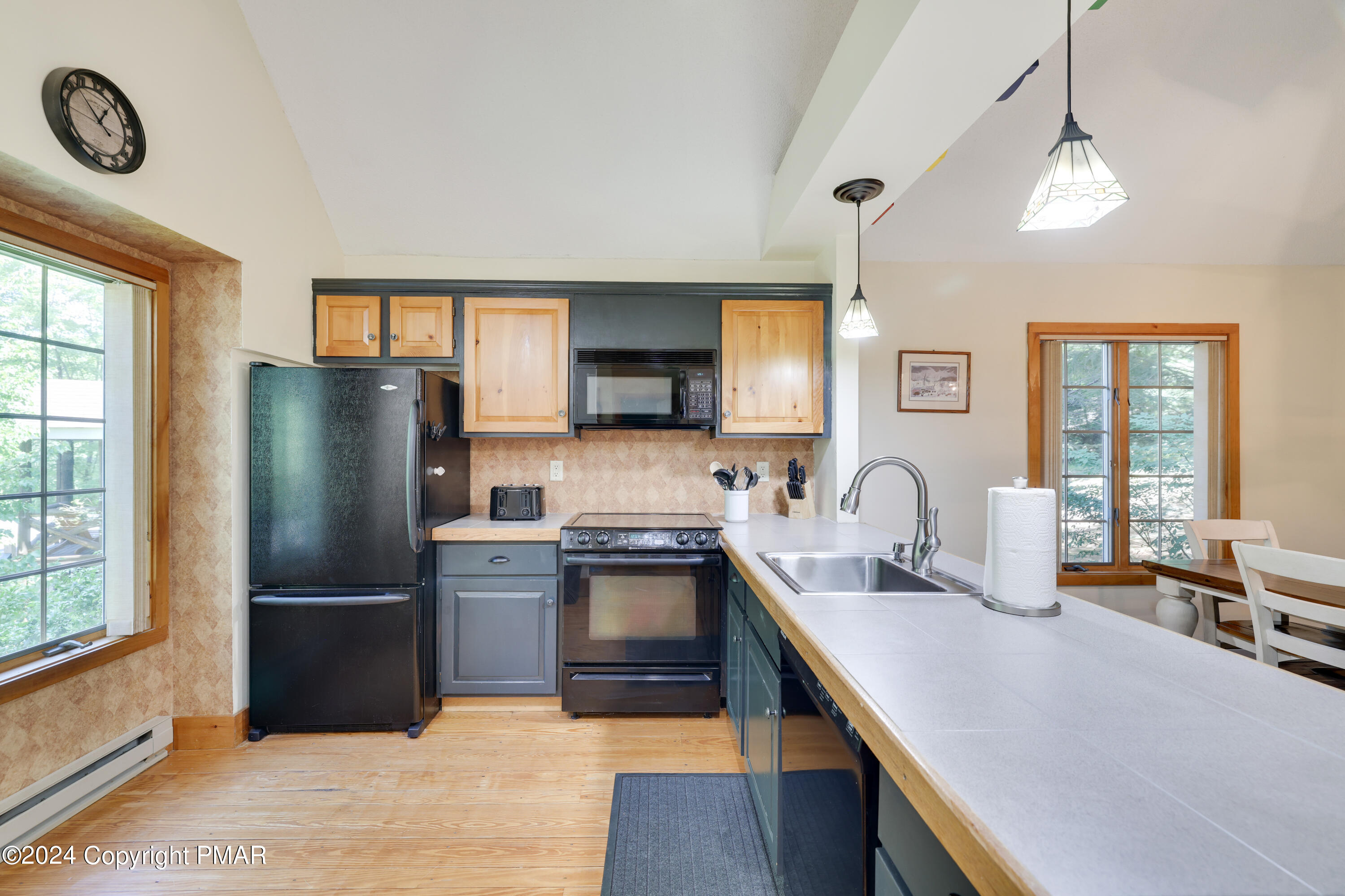 84 Short Hill Rd Lake Lake Harmony, PA 18624 - Photo 10 of 38 a kitchen with granite countertop a refrigerator stove and sink