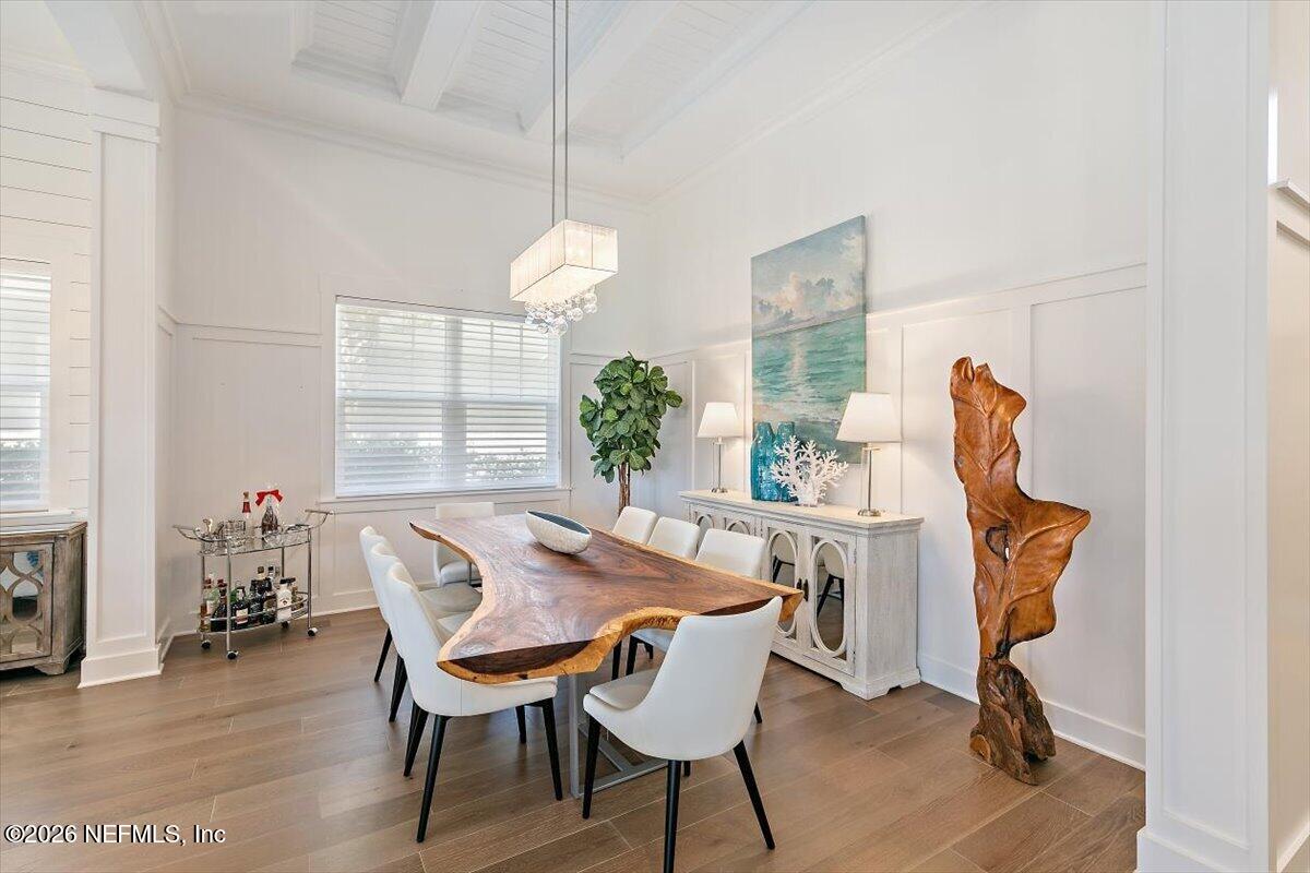 556 Timber Bridge Lane Atlantic Beach, FL 32233 - Photo 17 of 71 a view of a dining room with furniture and wooden floor