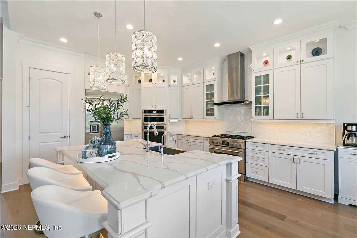 556 Timber Bridge Lane Atlantic Beach, FL 32233 - Photo 18 of 71 a kitchen with stainless steel appliances kitchen island granite countertop a sink and cabinets