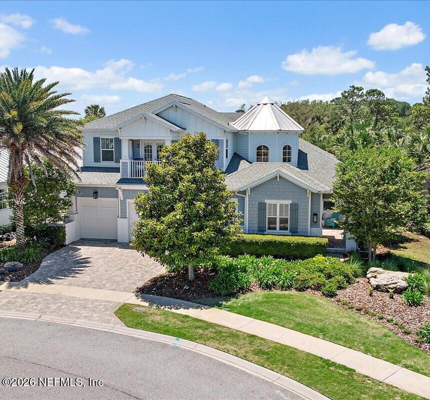 556 Timber Bridge Lane Atlantic Beach, FL 32233 - Photo 2 of 71 a front view of a house with a yard and garage