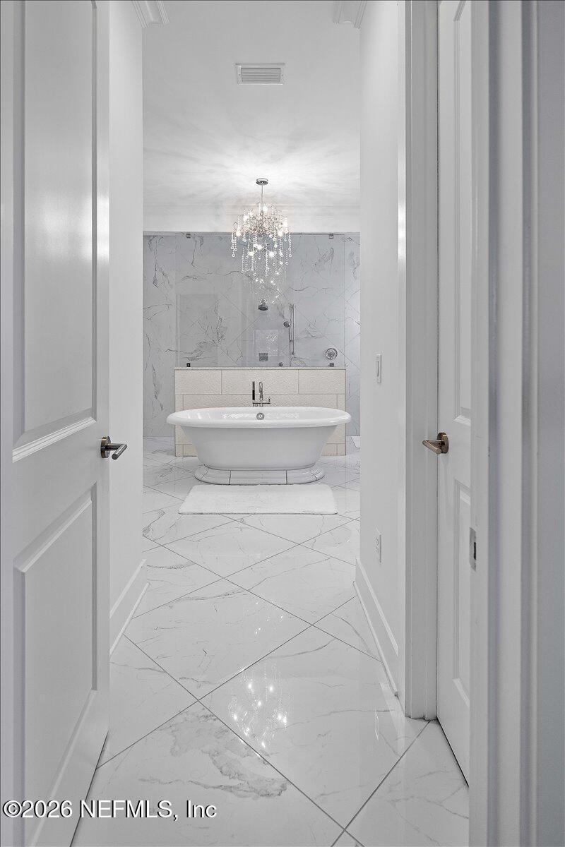556 Timber Bridge Lane Atlantic Beach, FL 32233 - Photo 30 of 71 a bathroom with a mirror and a shower