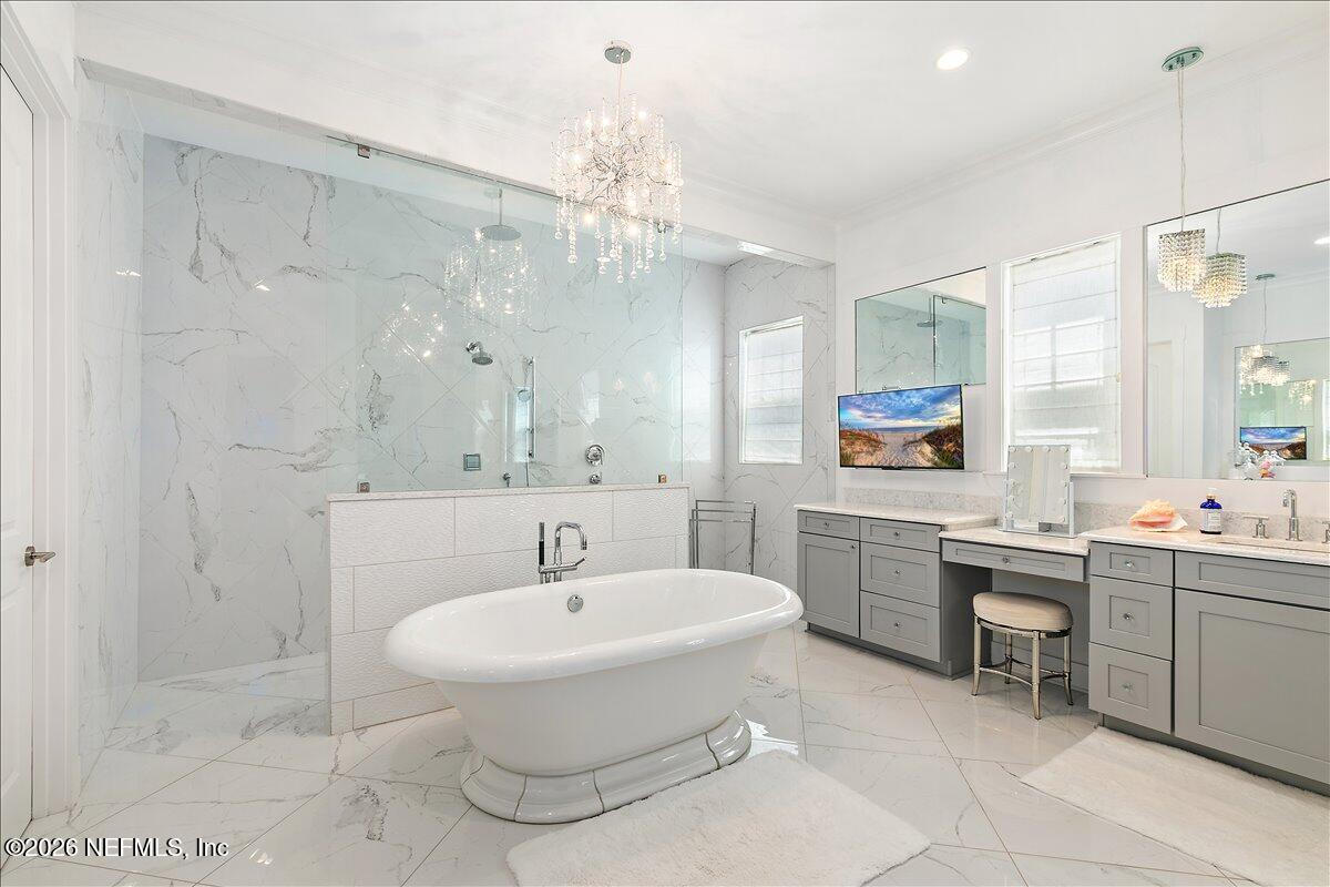 556 Timber Bridge Lane Atlantic Beach, FL 32233 - Photo 31 of 71 a bathroom with a sink a toilet a mirror and shower